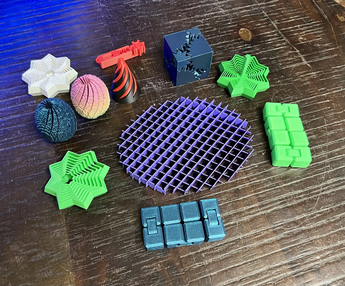 A collection of assorted 3D-printed fidget toys